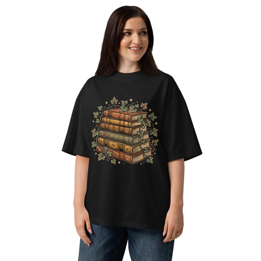 Stack of vintage books wound with ivy on a black oversized high-neck tee, front view