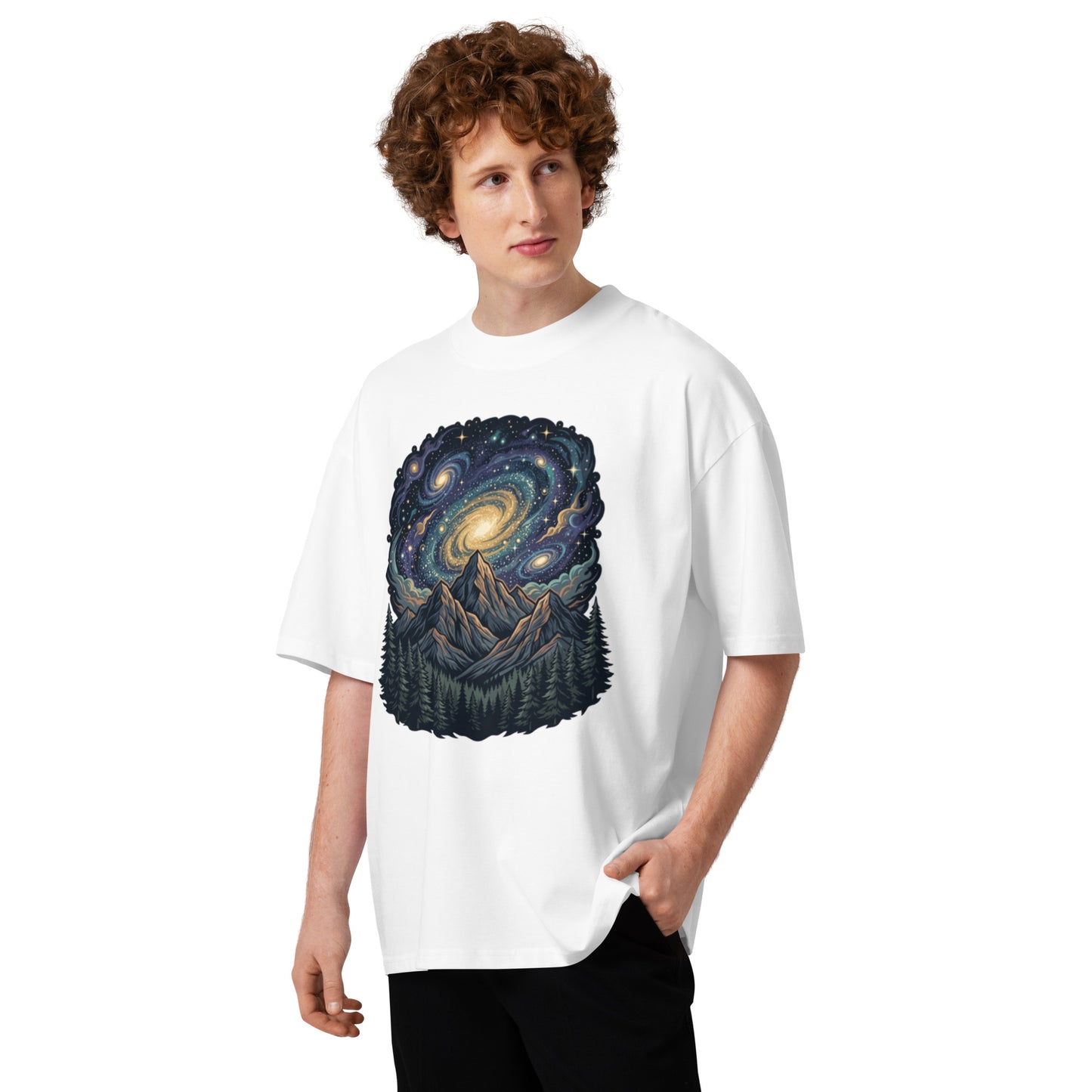 Spiral galaxy above pine-covered mountains on a white oversized high-neck tee, front view