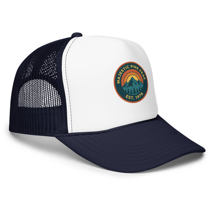 Navy and white retro mountain sunset trucker hat with mesh back, angled view