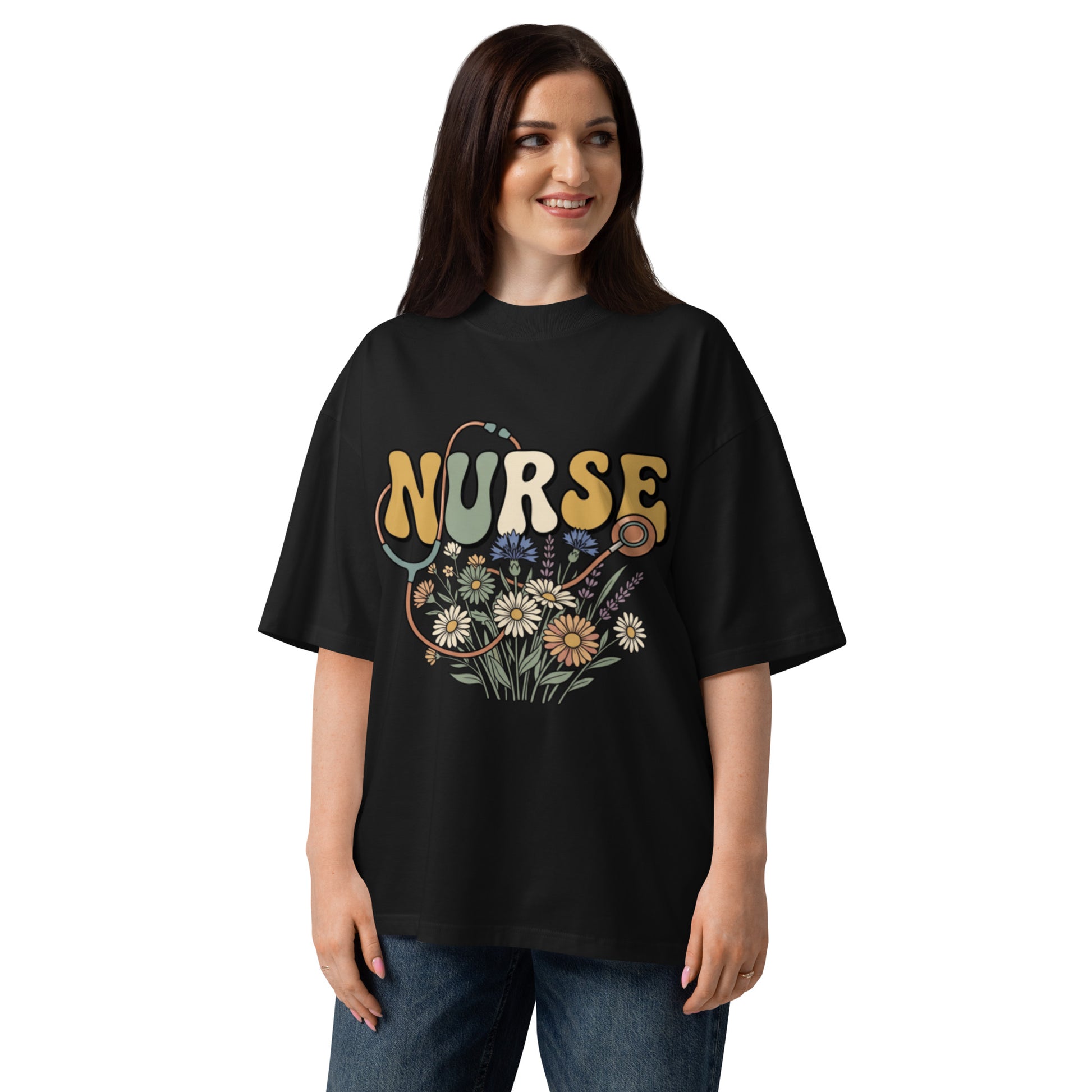 Retro Nurse lettering in a bed of wildflowers on a black oversized high-neck tee, front view