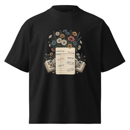 Vintage library due-date card with wildflowers on a black oversized high-neck tee, front view