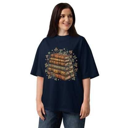 Stack of vintage books wound with ivy on a French Navy oversized high-neck tee, front view