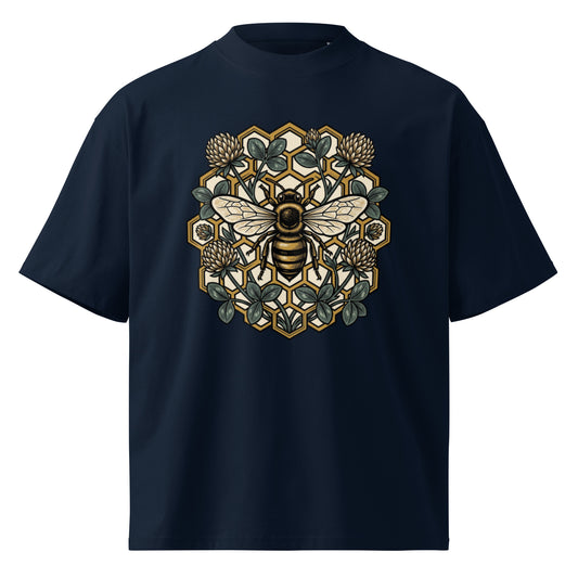 Geometric honeycomb and bee design in teal and gold on a French Navy oversized high-neck tee, front view
