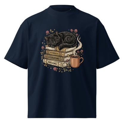 Black cat asleep on a stack of books with coffee and roses, on a French Navy oversized high-neck tee, front view