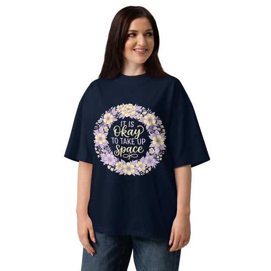 It Is Okay To Take Up Space in a pastel wildflower wreath on a French Navy oversized high-neck tee, front view