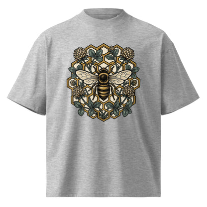 Geometric honeycomb and bee design in teal and gold on a heather grey oversized high-neck tee, front view