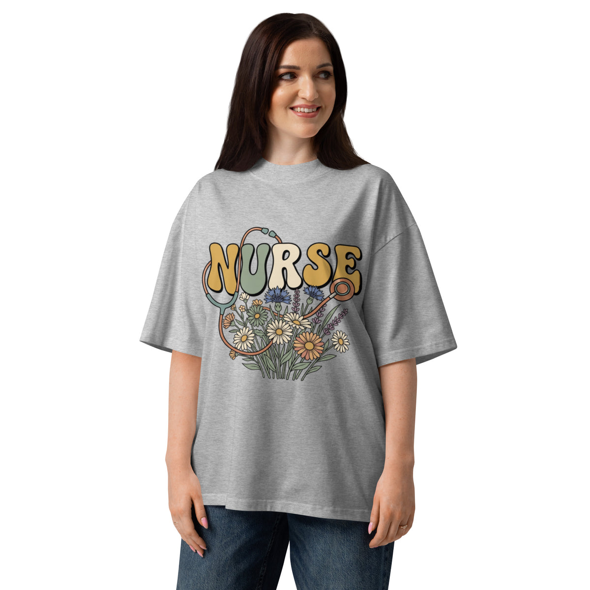 Retro Nurse lettering in a bed of wildflowers on a heather grey oversized high-neck tee, front view