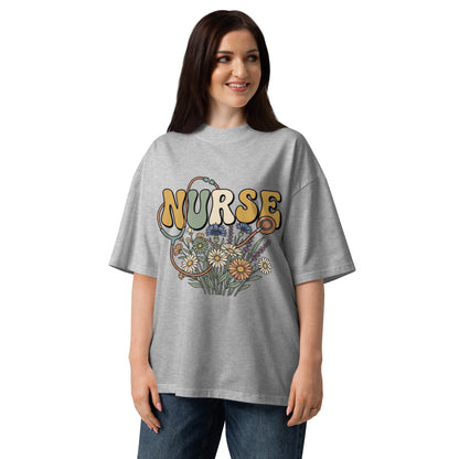 Retro Nurse lettering in a bed of wildflowers on a heather grey oversized high-neck tee, front view