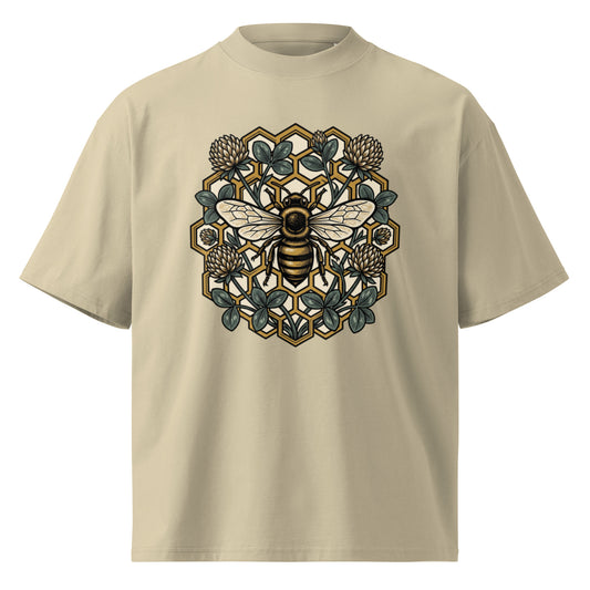 Geometric honeycomb and bee design in teal and gold on a stone oversized high-neck tee, front view