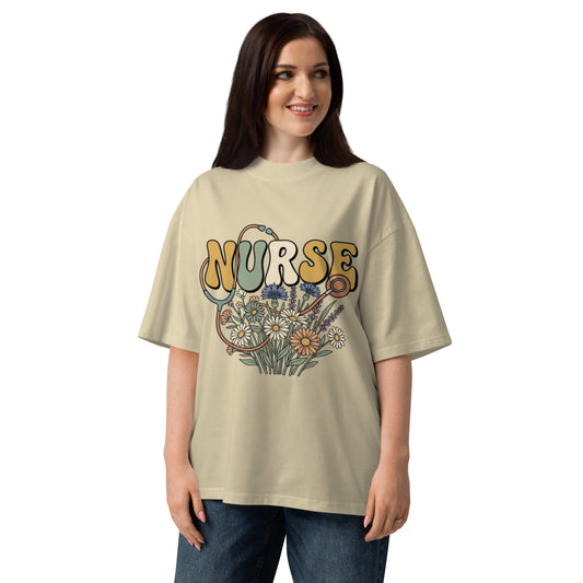 Retro Nurse lettering in a bed of wildflowers on a stone oversized high-neck tee, front view