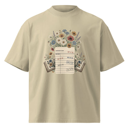 Vintage library due-date card with wildflowers on a stone oversized high-neck tee, front view