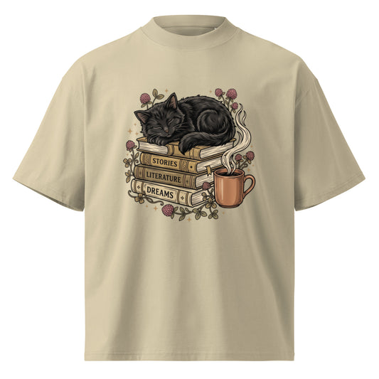 Black cat asleep on a stack of books with coffee and roses, on a stone oversized high-neck tee, front view