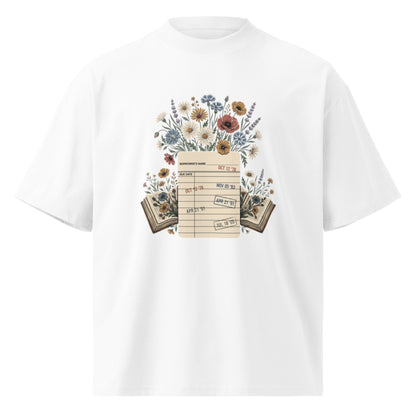 Vintage library due-date card with wildflowers on a white oversized high-neck tee, front view