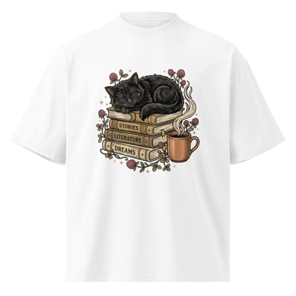 Black cat asleep on a stack of books with coffee and roses, on a white oversized high-neck tee, front view