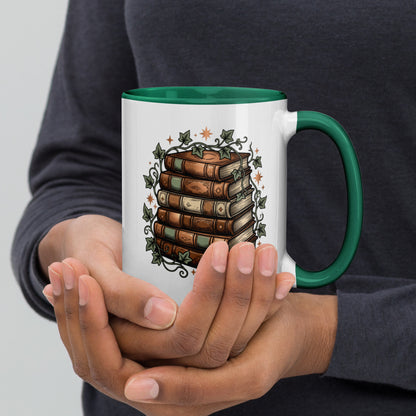 Stacked books and ivy design on a white ceramic mug with dark green rim and handle, 15 oz, right view