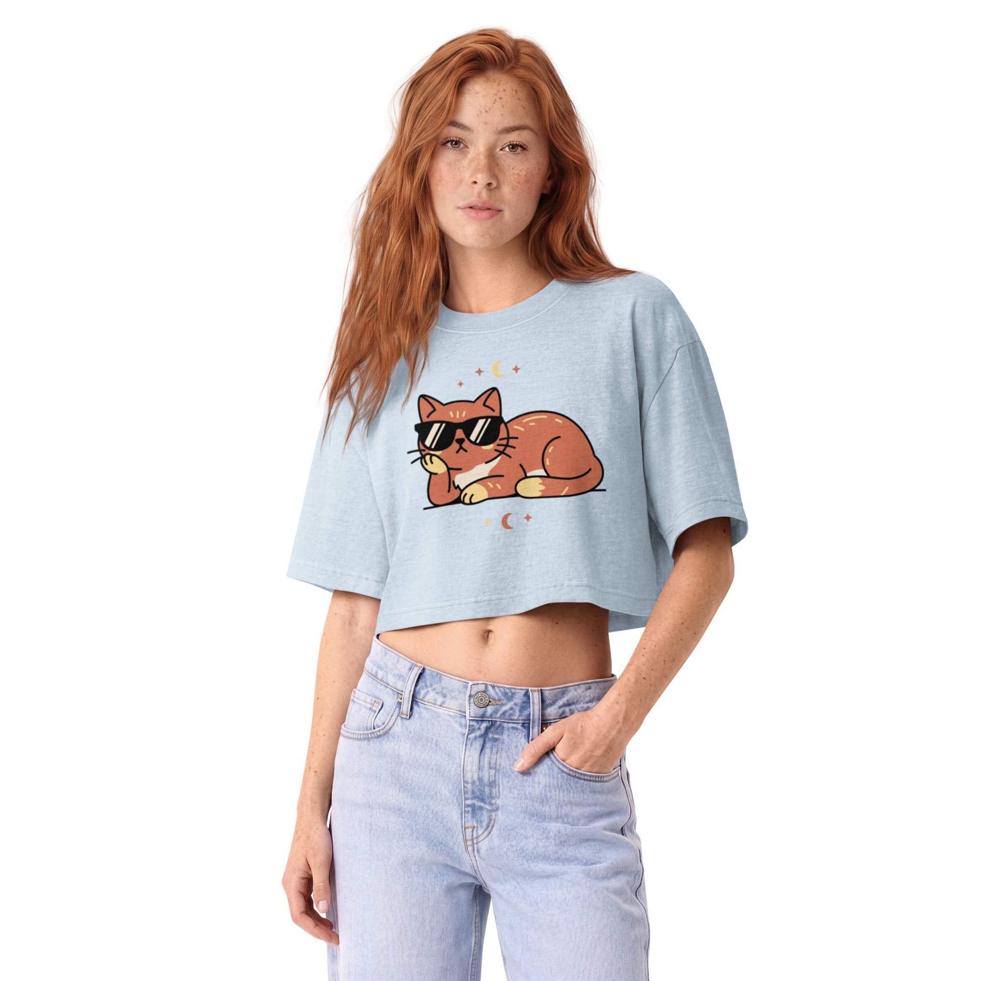 Ginger cat in sunglasses with crescent moons printed on a light washed denim garment-dyed cropped tee, front view