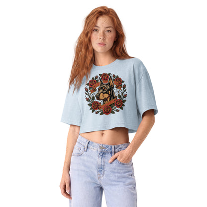 Tattoo-style Doberman framed in red roses on a light washed denim garment-dyed cropped tee, front view
