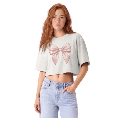 Oversized blush pink satin bow printed on a vintage white garment-dyed cropped tee, front view