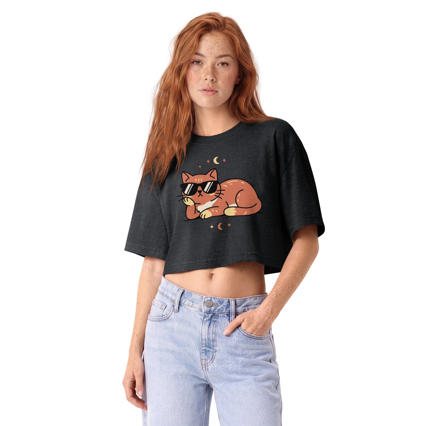 Ginger cat in sunglasses with crescent moons printed on a washed black garment-dyed cropped tee, front view