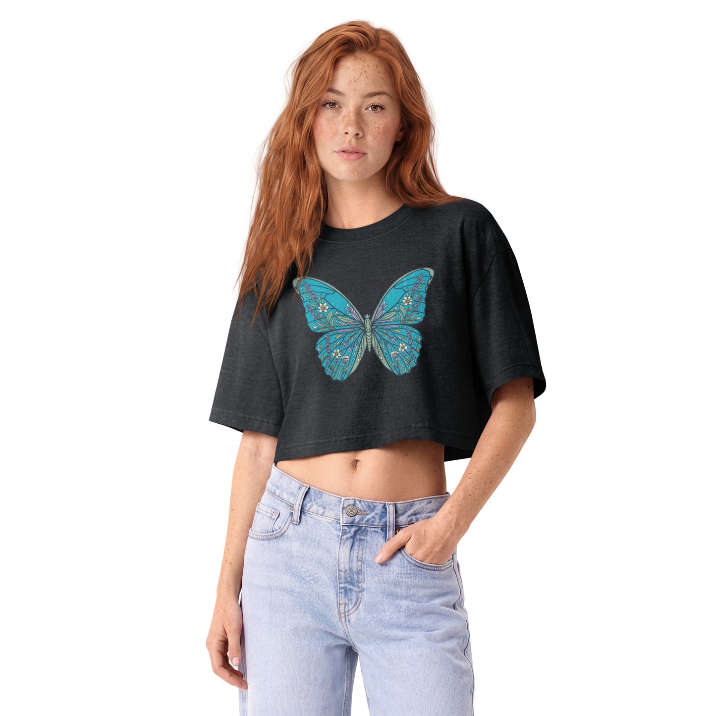 Detailed teal morpho butterfly printed on a washed black garment-dyed cropped tee, front view